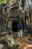 crw_6809 Eu-Jin looking at a strangler fig in Ta Prohm.