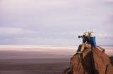 crw_3312-ray-3970 Serene and I perched on the tallest boulder at the viewpoint over the Salar de Uyuni. Taken by Ray Woo.