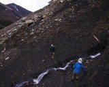 crw_3903-ray-4368 The climber's trail into the Valle del Silencio is over scree, talus, and boulder fields. Parts of the narrow trail had been wiped out by rock fall. Here, Serene is crossing the trickiest part of the trail that has a steep dropoff on the left and is also slick with water. Taken by Ray Woo.