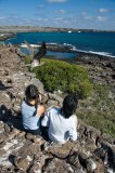 _mg_3657 Eileen and Serene with a blue-footed booby overhead at Darwin Bay on Genovesa