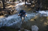 yosemite01 Serene crossing one of the many swollen creeks. As you can see, her sandal fell off on this crossing.