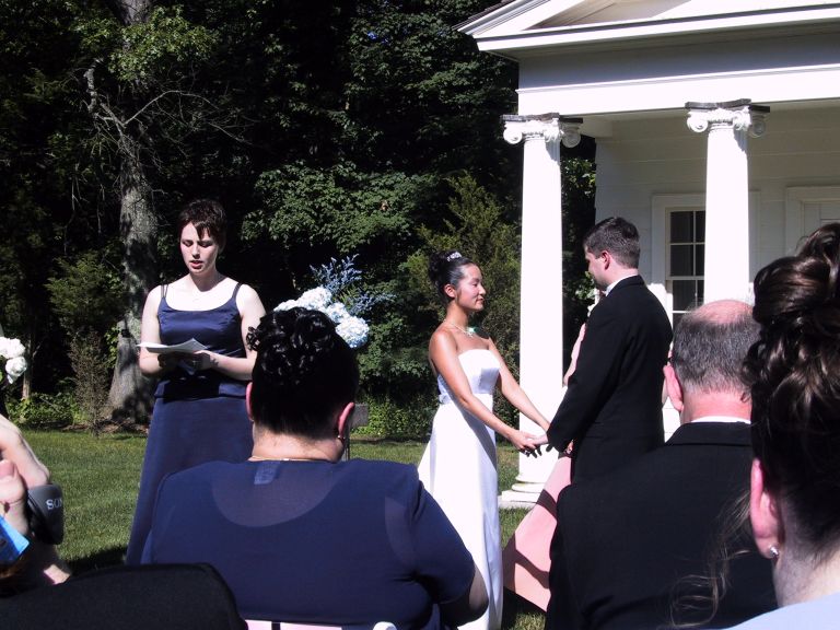 Erin reading at ceremony.